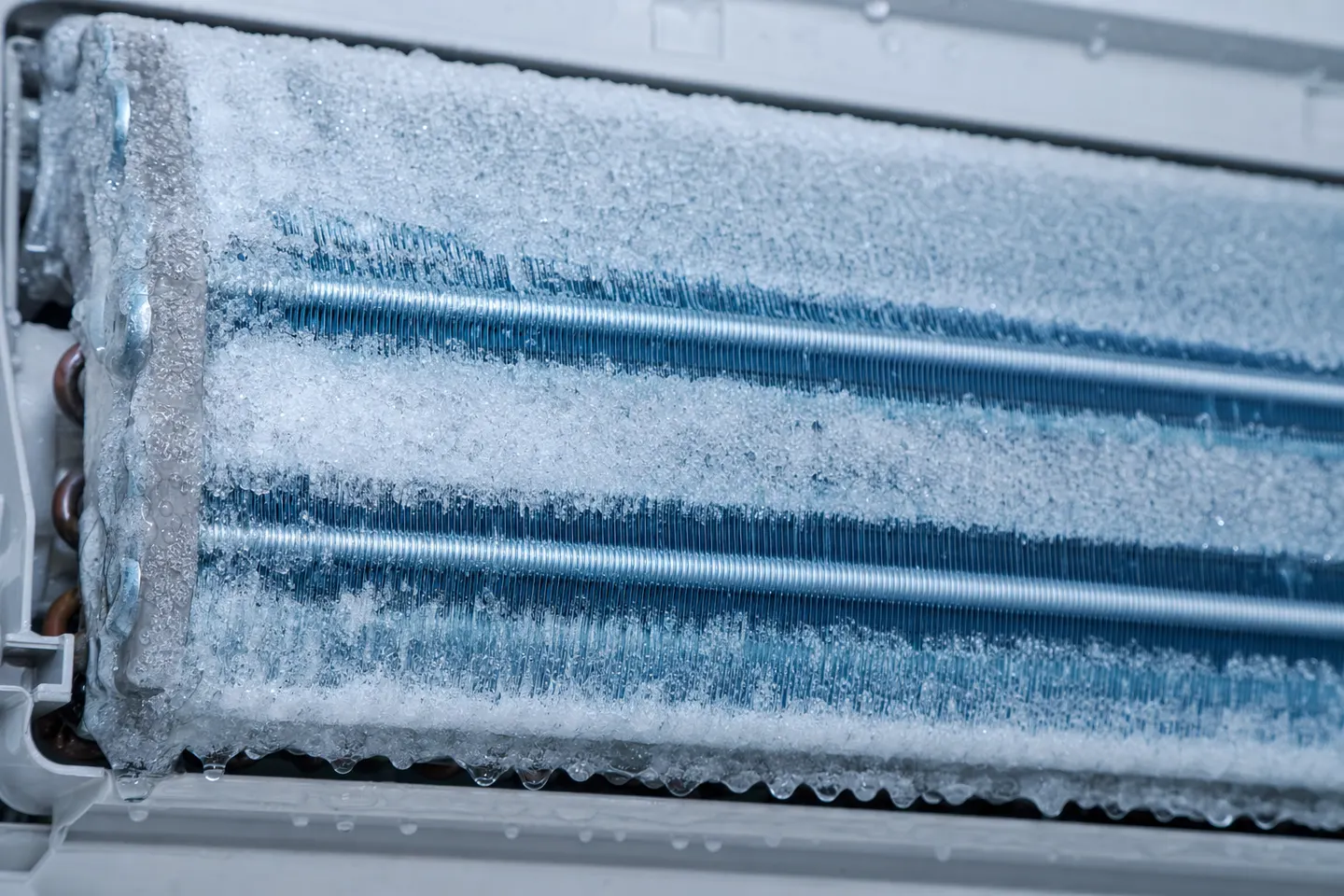 Frozen evaporator coil and insulated refrigerant line in a NYC apartment air conditioner